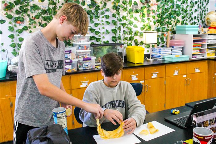 Students working together with pringles